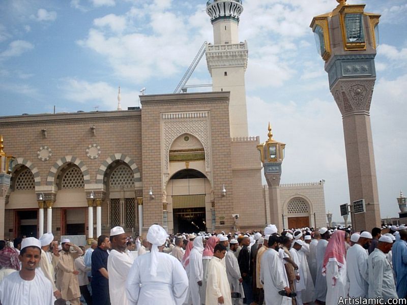 The Prophet Muhammad`s (saaw) Mosque (Masjed an-Nabawe) in Madina city of Saudi Arabia and the muslims going out of mosque after a prayer time.
